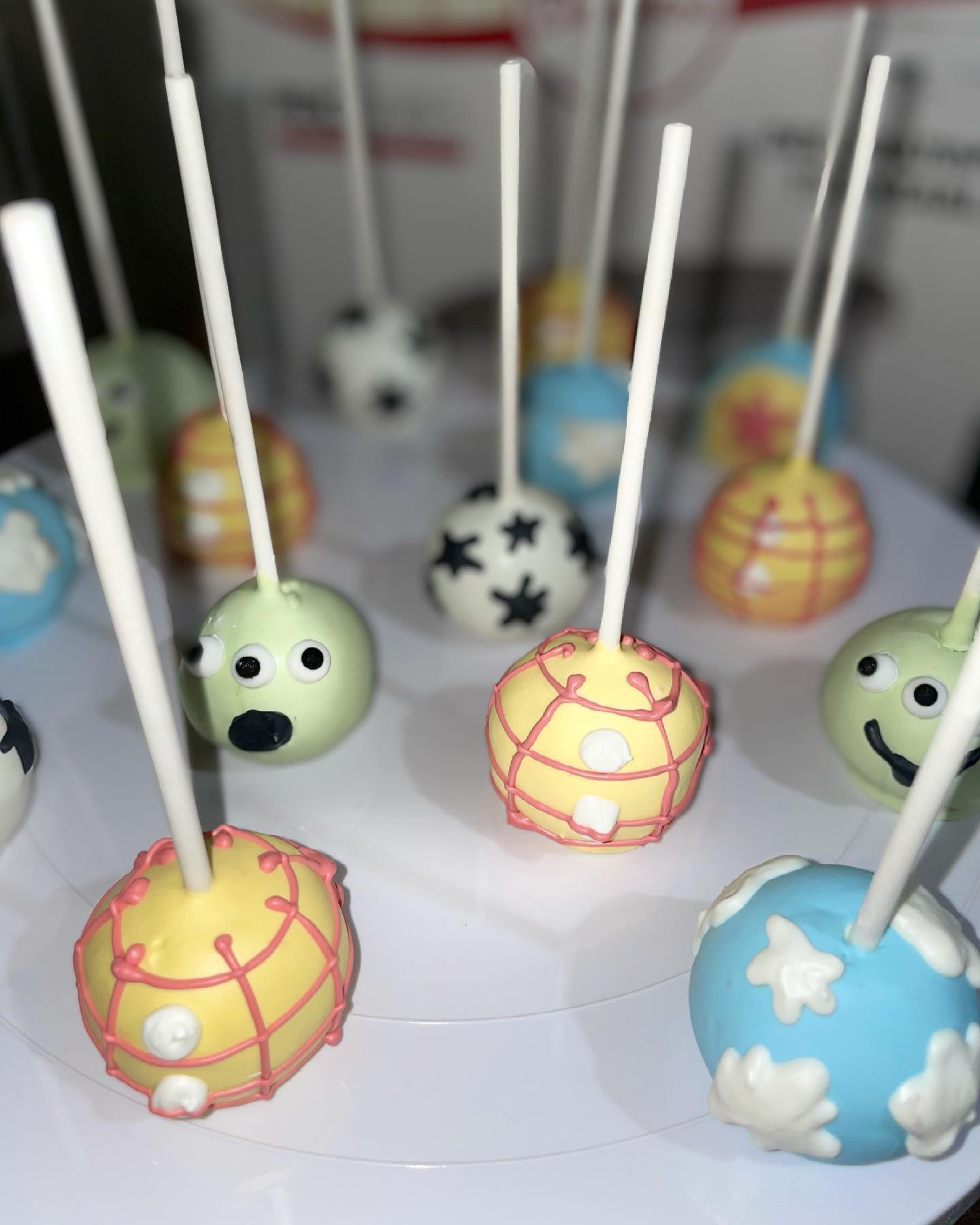 Colorful themed cake pops with fun character designs