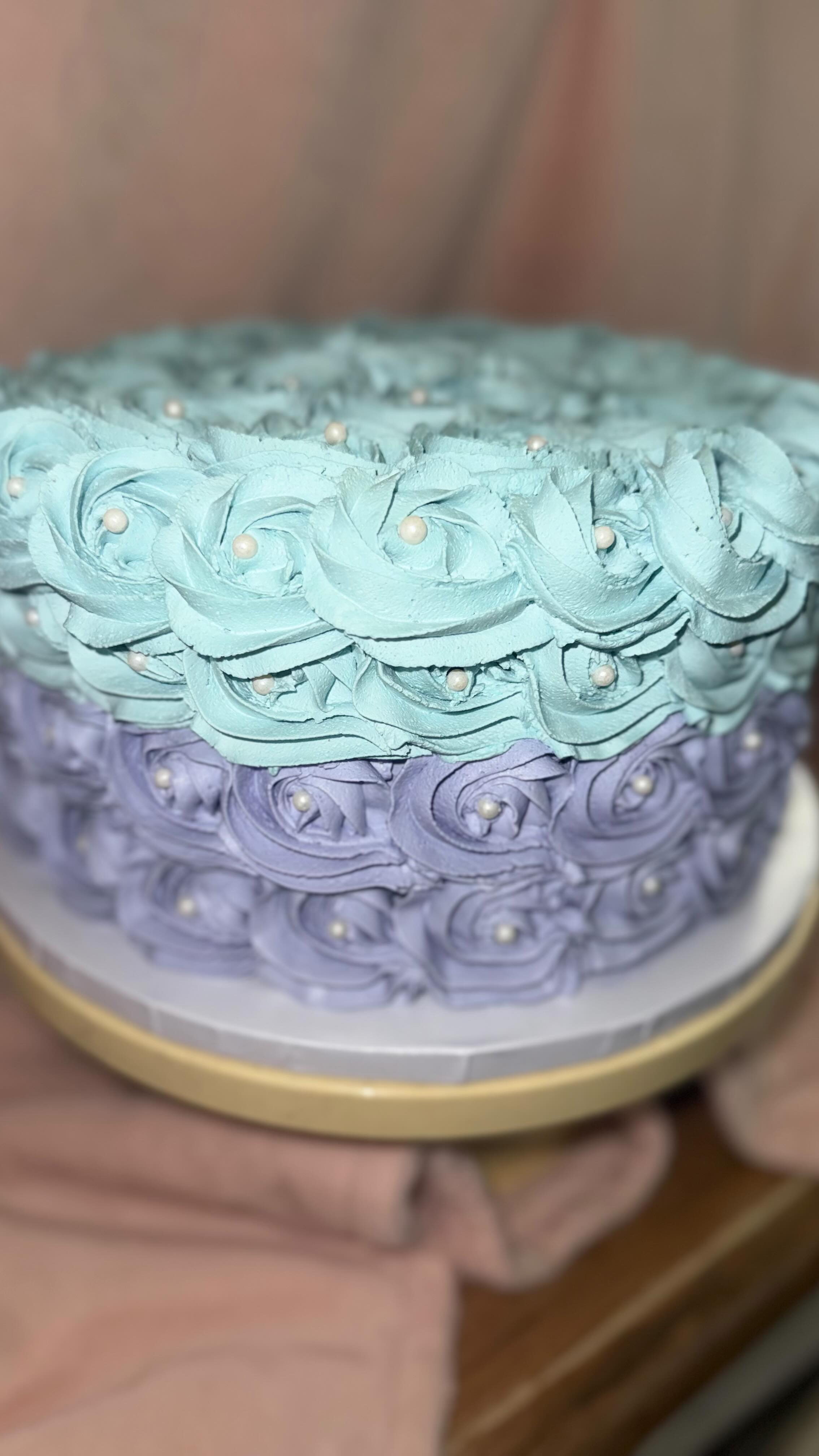 Custom rosette cake with teal and lavender frosting
