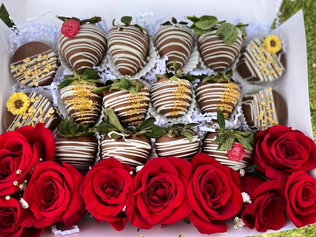 Chocolate covered strawberries with gold accents and red roses